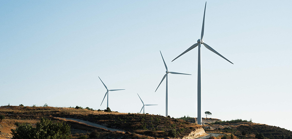 In the image representing the wind power plants in Turkey, there are 4 wind power plants located on the tops of the mountains in a row.